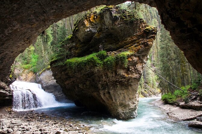 8 Iconic Stops. 12 Comfy Seats. See Banff's Best in First Class. - Bow Falls: an easy Banff finale