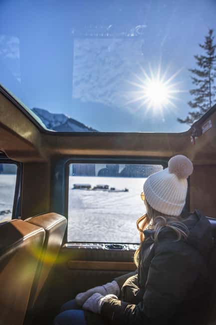 Banff: Winter Tour with Dinner & Nightrise at Banff Gondola - Riding Banff in an open-top vintage car