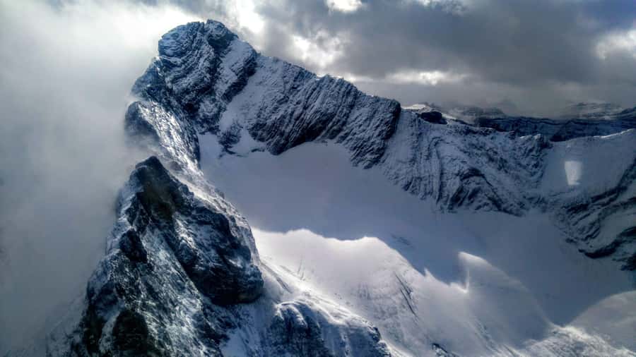 Canmore: 25-Minute Three Sisters Helicopter Tour - Crossing the Bow River toward the Three Sisters