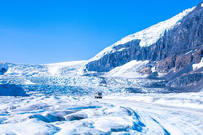 Columbia Icefield Tour with Glacier Skywalk from Calgary - Riding the Ice Explorer onto Athabasca Glacier