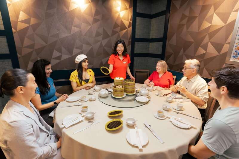 Downtown Vancouver: Asian Eats Walking Food Tour - Tasting dim sum at an award-winning restaurant
