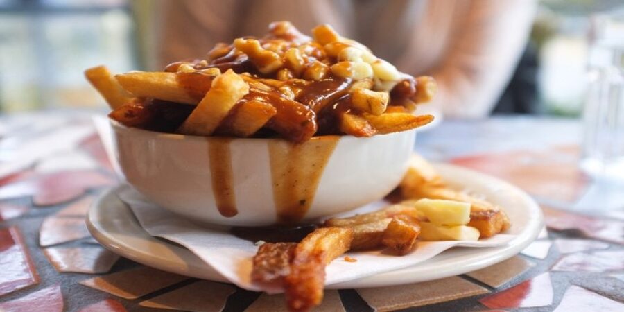 Montreal: Best of Montreal Food Walking Tour with Tastings - Poutine, the Quebec classic that fills you fast