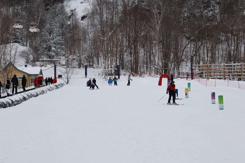 Montreal: Guided Skiing in Quebec Forests - Getting fitted with skis, a helmet, and winter gear