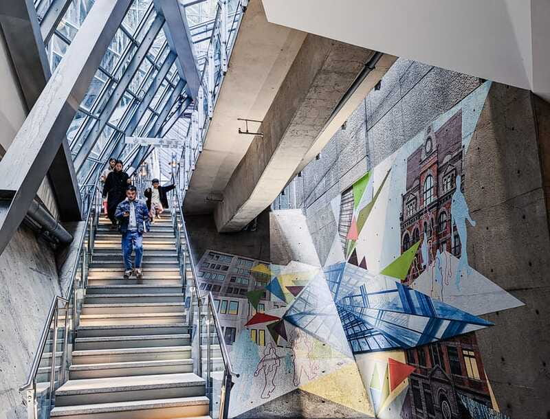 Montreal: RESO Underground City and Downtown Walking Tour - Entering the RESO through corridors, escalators, and stairs