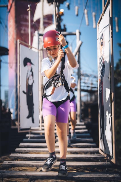 Montreal: Voiles En Voiles Aerial Park Admission Ticket - The climbing wall, carousel, and giant inflatables